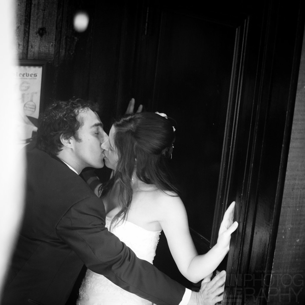 Dodging raindrops beneath the overhangs of George Street for a wedding picture.