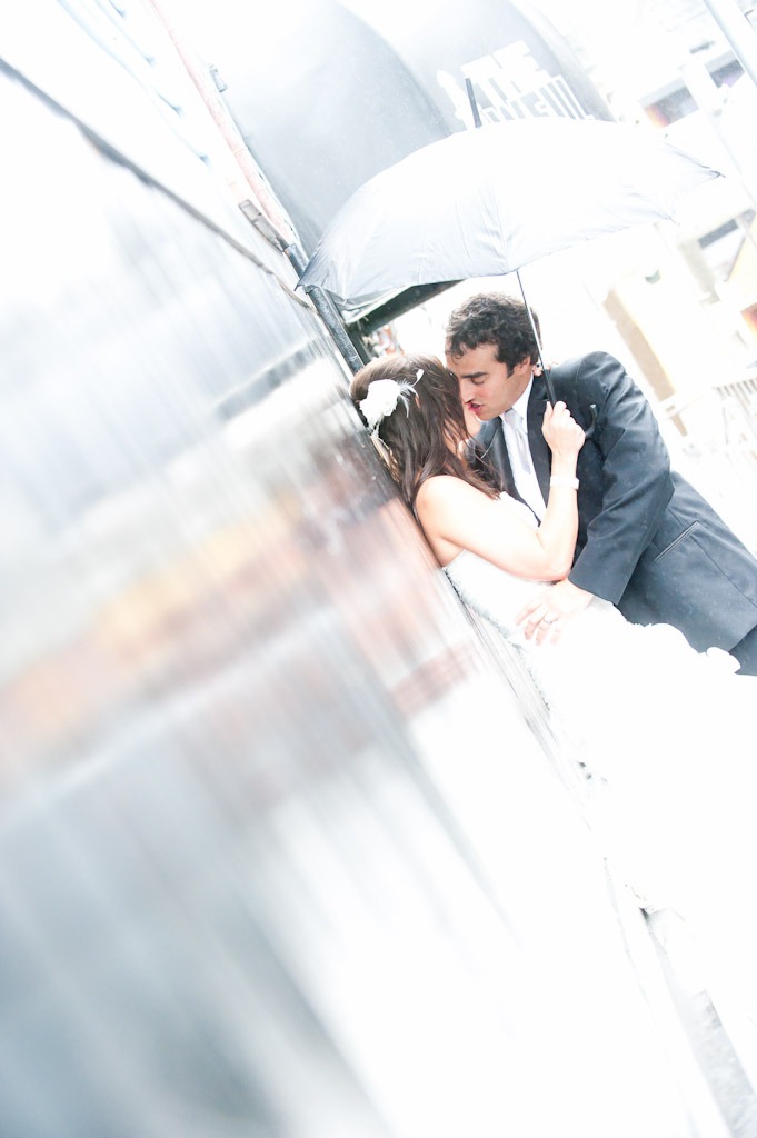 A newlywed couple poses for a wedding picture.