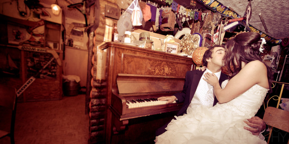 In the Inn of Olde the wedding couple make out on a piano.