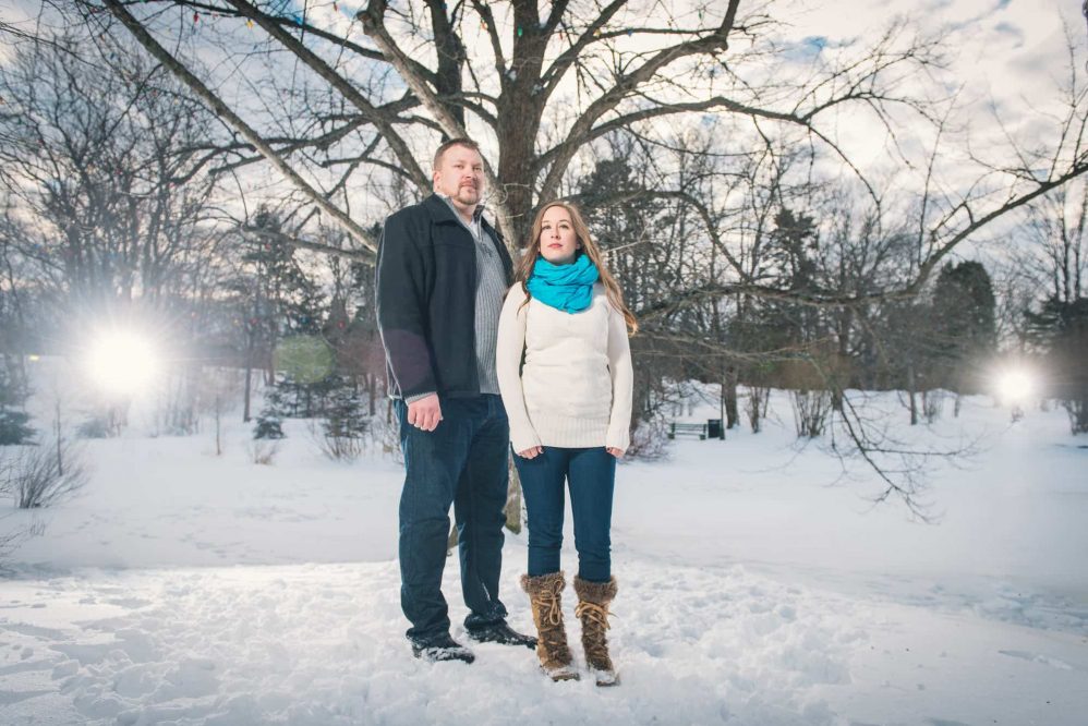 An epic of photo of a newly engaged couple in the park.