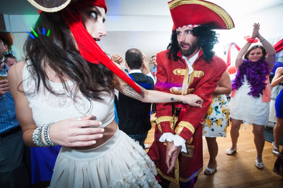 The groom dressed up as Captain Morgan to dance and hand out free booze at his wedding!