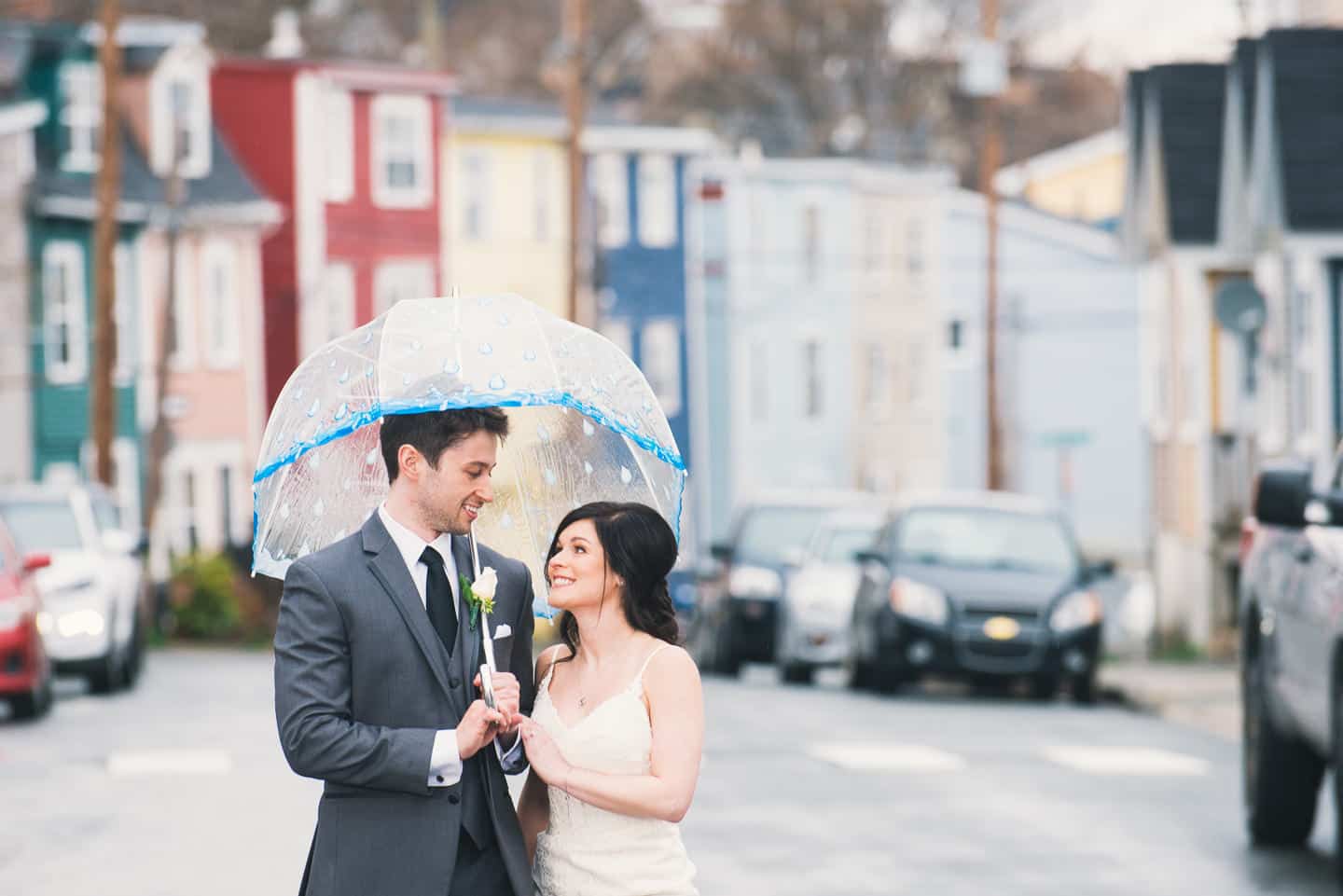 A picture of a bride and groom holding hands in scenic downtown St. John's, Newfoundland, Canada