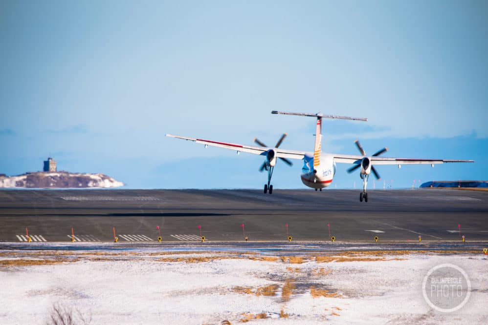 PAL flight fights the crosswinds with Signal Hill in the background.