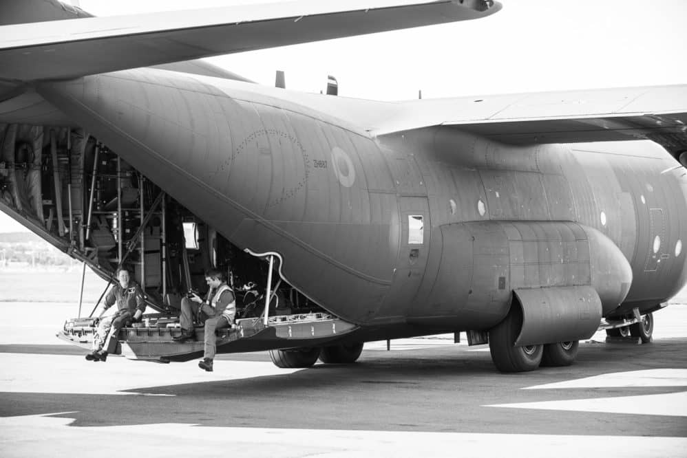 A couple of RAF pilots hang out on the back of their C130