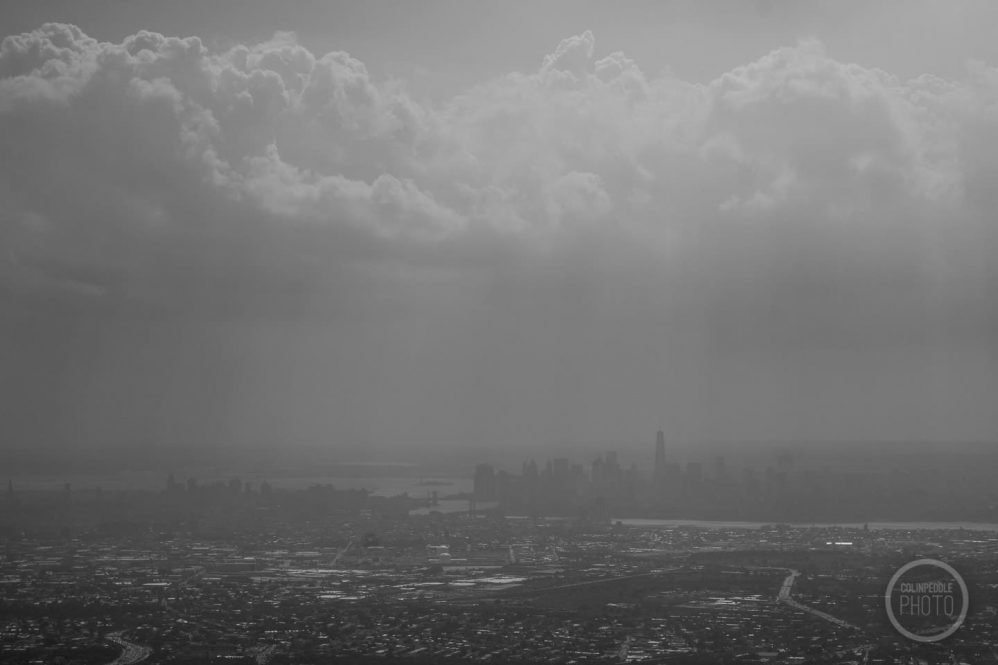 A cloudy skyline shot of New York from above.