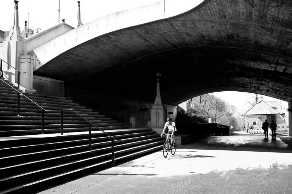 A bicyclist makes his way along the canal in Ottawa, Ontario, Canada