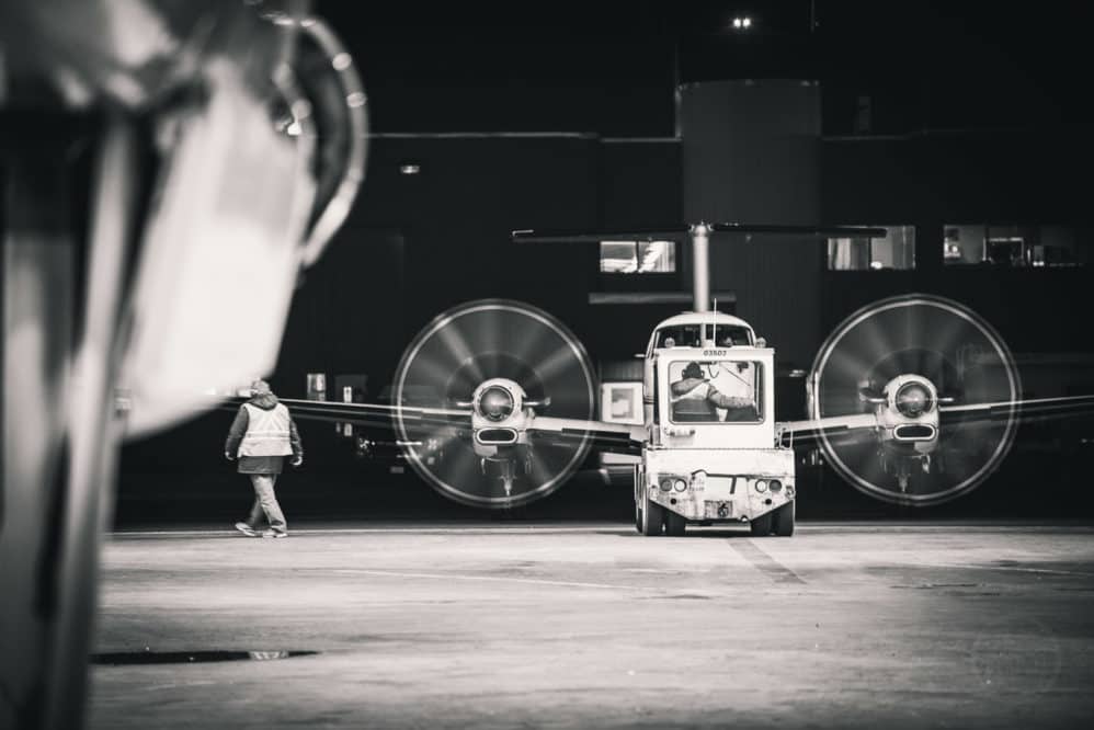 An air ambulance flight is pushed back from the hanger.