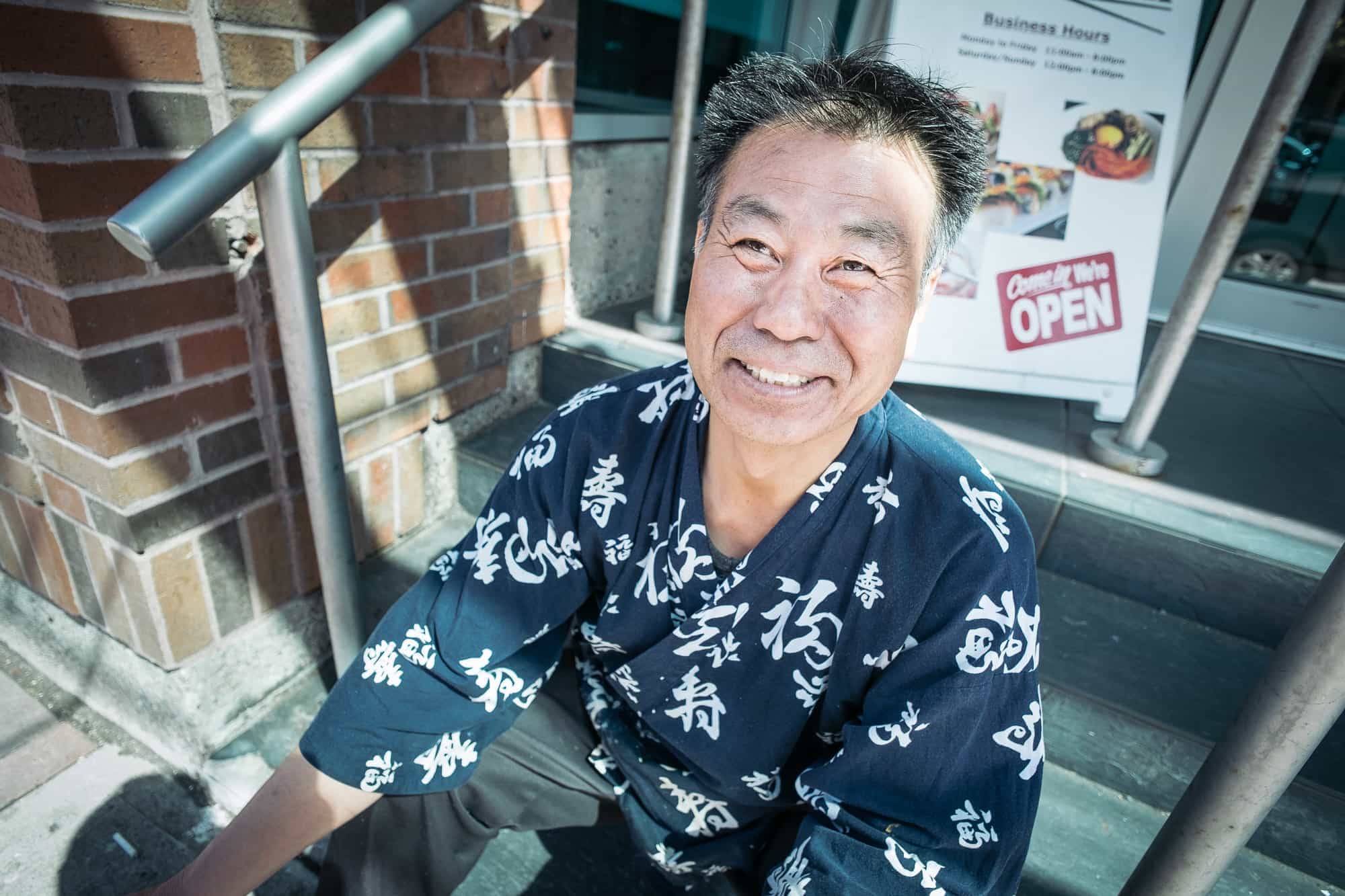 A photograph of a cook from sushi restaurant.