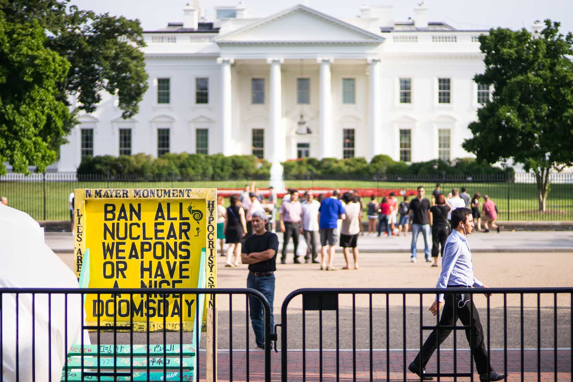 In Washington, D.C. a protestor camps in front of the White House with a sign emploring the banning of all nuclear weapons.