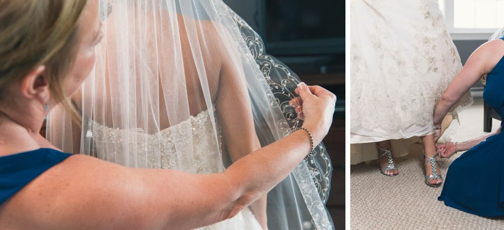 Mom getting her daughters wedding veil just so.