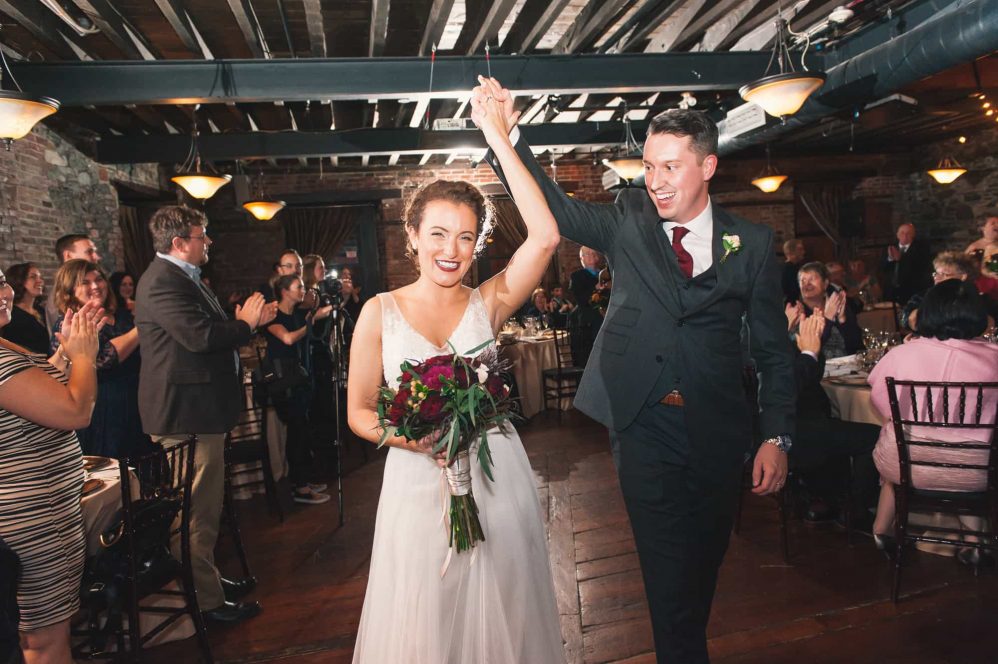 A bride and her groom strut down the aisle after tying the knot.