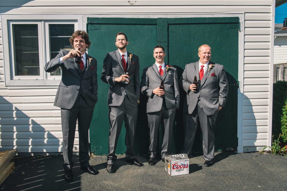 The boys hanging out in at the shed having a beer.