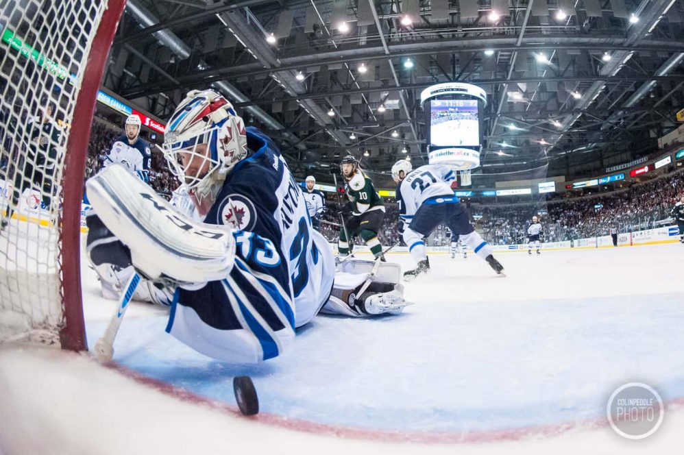 Michael Hutchinson saves a puck on the line as viewed from the netcam.